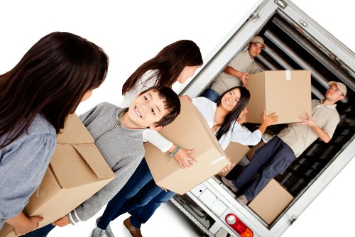 Professional house removals team working in a Bermondsey residential street