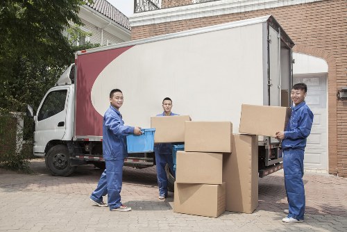 Furniture pick-up service removing a sofa in Bermondsey