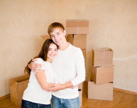 Local movers preparing furniture and boxes
