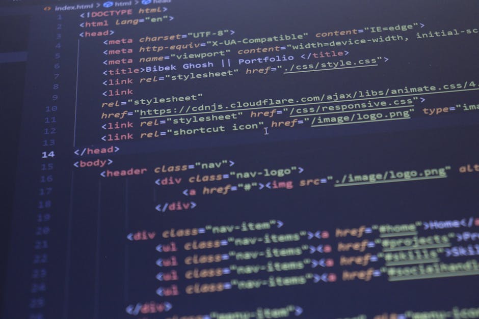 Close-up image of a computer screen displaying lines of colorful programming code, including functions, variables, and syntax in various shades of red, green, blue, yellow, and white. The code appears